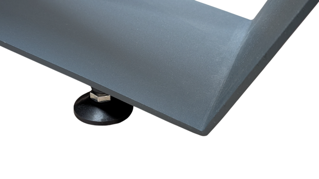 Close-up of a gray metal platform with a black circular adjustable foot and bolt underneath.