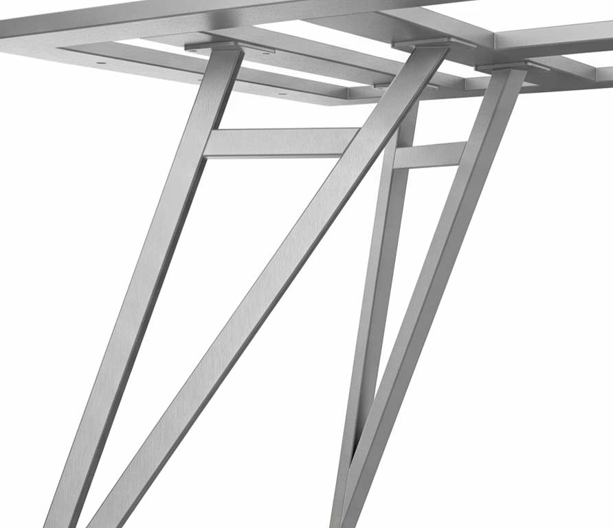 Close-up of a silver metal table frame showing angled legs and cross braces for support