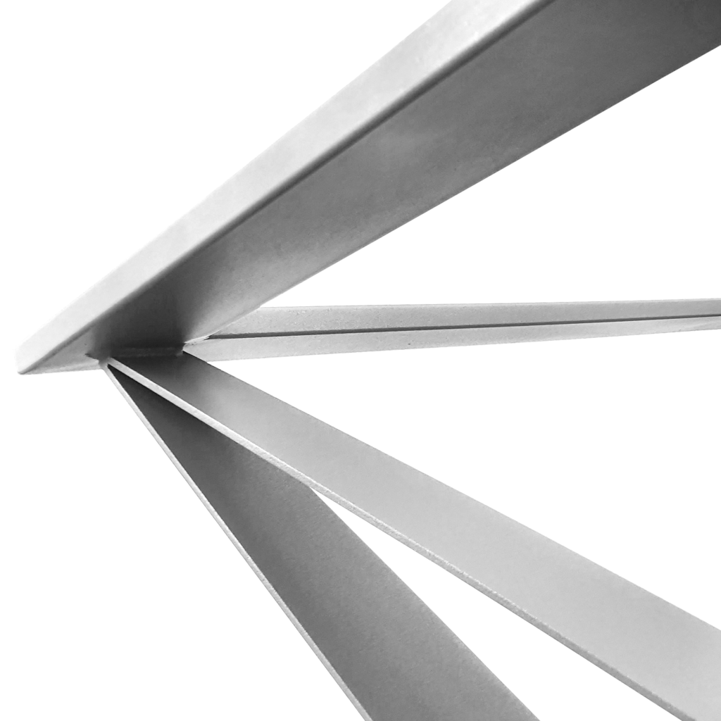 Black-and-white close-up of diagonal metal beams crossing each other in an abstract architectural detail.